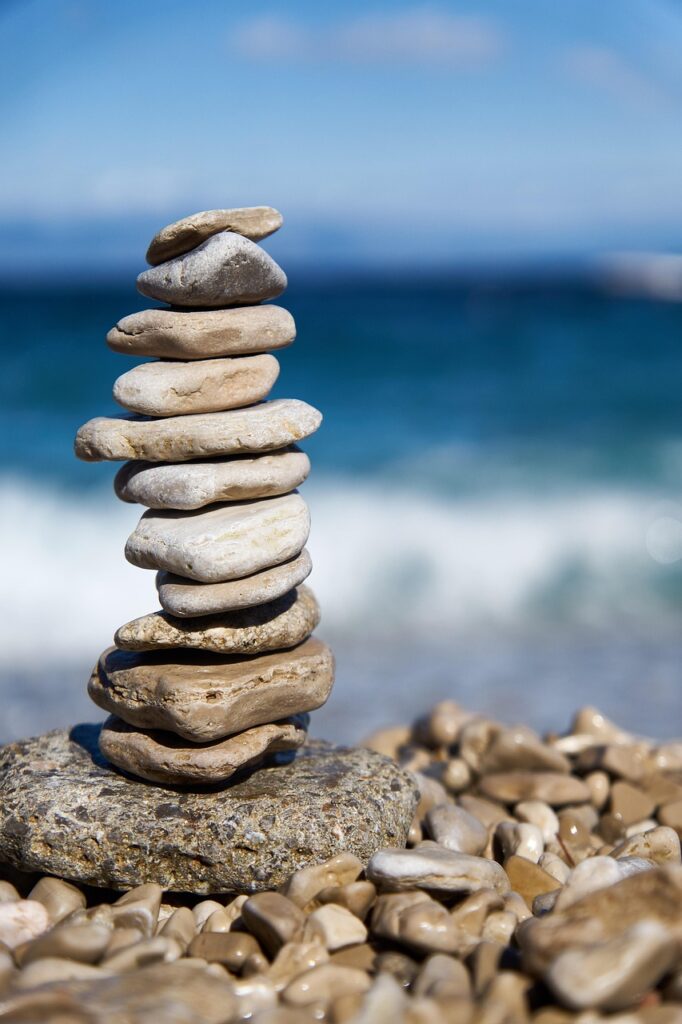 stones, rock, balance, nature, balanced rocks, balanced stones, riverbank, beach, meditation, zen, mindfulness, spirituality, harmony, sea representing the balance of the three pillars of the CIA Triad