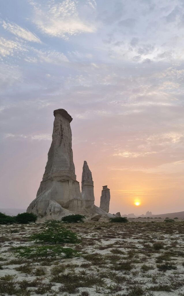 Stunning sunset behind the Three Pillars rock formations in Pishukan, Balochistan, Pakistan, representing the three pillars of the CIA triad: confidentiality, integrity, and availability