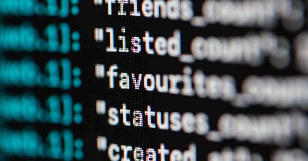 Extreme close-up of computer code displaying various programming terms and elements.